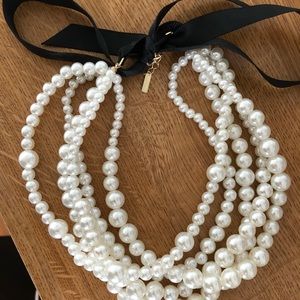 Black Bow and Pearl Necklace